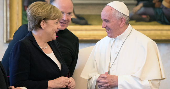 Chancellor Angela Merkel (centre) in conversation with Pope Francis (at right) in the Apostolic Palace