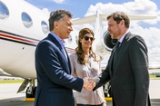 Argentine President Mauricio Macri and his wife Juliana Awada are welcomed as they arrive at the Hamburg Airport.