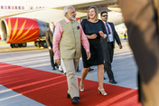 The Prime Minister of India, Narendra Modi, is welcomed by Katarina Fegebank, Second Mayor of Hamburg, at Hamburg Airport on his arrival at the G20 Summit.