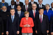 Chancellor Angela Merkel during the family photo surrounded by the G20 heads of state and government and other G20 participants.