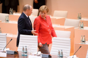 Chancellor Angela Merkel speaking with Russian President Vladimir Putin before the start of the first working session of the G20 Summit.