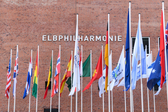 Flags of the G20 countries in front of the Elbphilharmonie.