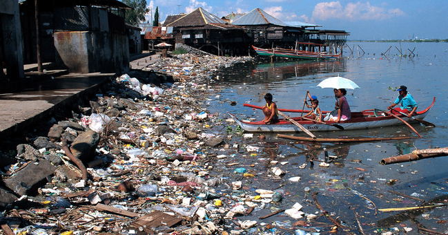 A coast buried under mounds of waste