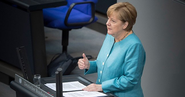 Chancellor Angela Merkel delivers a government statement in the German Bundestag.