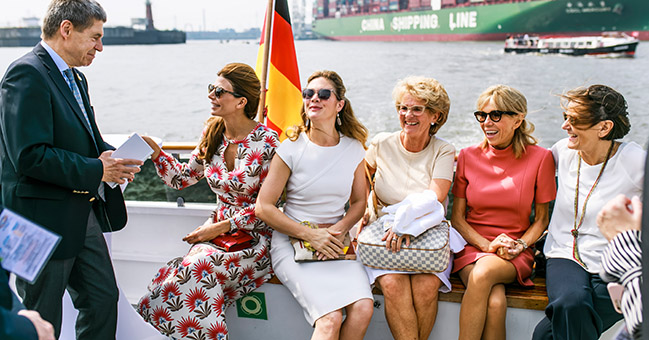Joachim Sauer and some of the spouses of G20 leaders during the boat trip around Hamburg’s harbour area