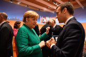 Federal Chancellor Angela Merkel discusses with France's President Emmanuel Macron following the G20 summit’s last working session.
