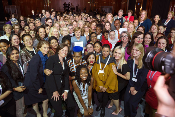 Chancellor Angela Merkel (centre holding communiqué) with all W20 summit participants
