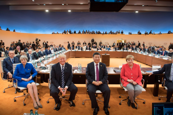 Group photo of the G20 heads of state and government and other participants at the start of the first working session. 