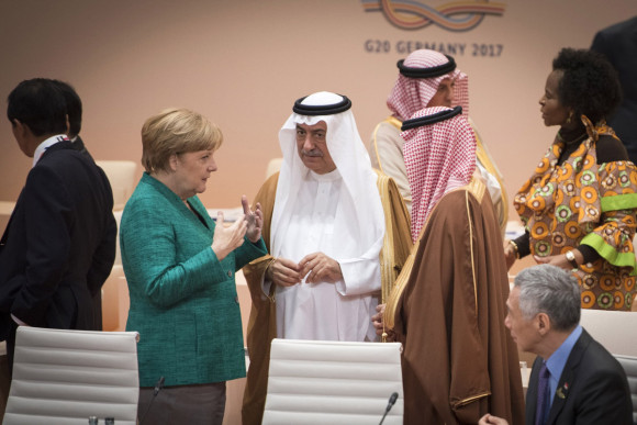 Federal Chancellor Angela Merkel in conversation with Ibrahim bin Abdulaziz Al-Assaf, State Minister of Saudi Arabia, before the start of the third working session.